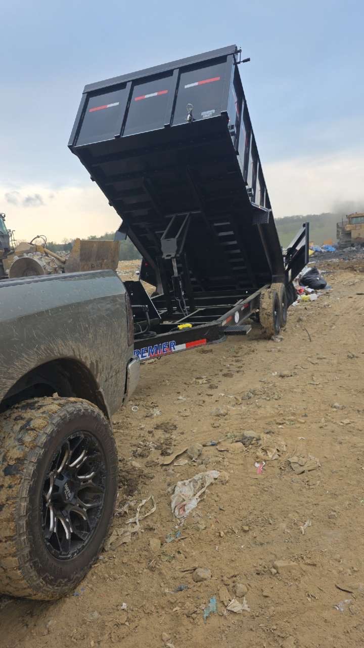 Dump trailer unloading at a job site